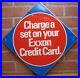 CHARGE-A-SET-ON-YOUR-EXXON-CREDIT-CARD-Original-Gas-Station-Shop-Tire-Ad-Sign-01-ki