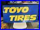 Toyo-Tire-Embossed-Metal-Authentic-Man-Cave-47x23-5-Garage-Sign-Vintage-01-myem
