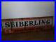 Vintage-1940s-RARE-Porcelain-over-metal-SEIBERLING-TIRE-Sign-THE-PROTECTED-TIRE-01-qekk