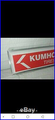 Vintage kumho tires lighted sign clock